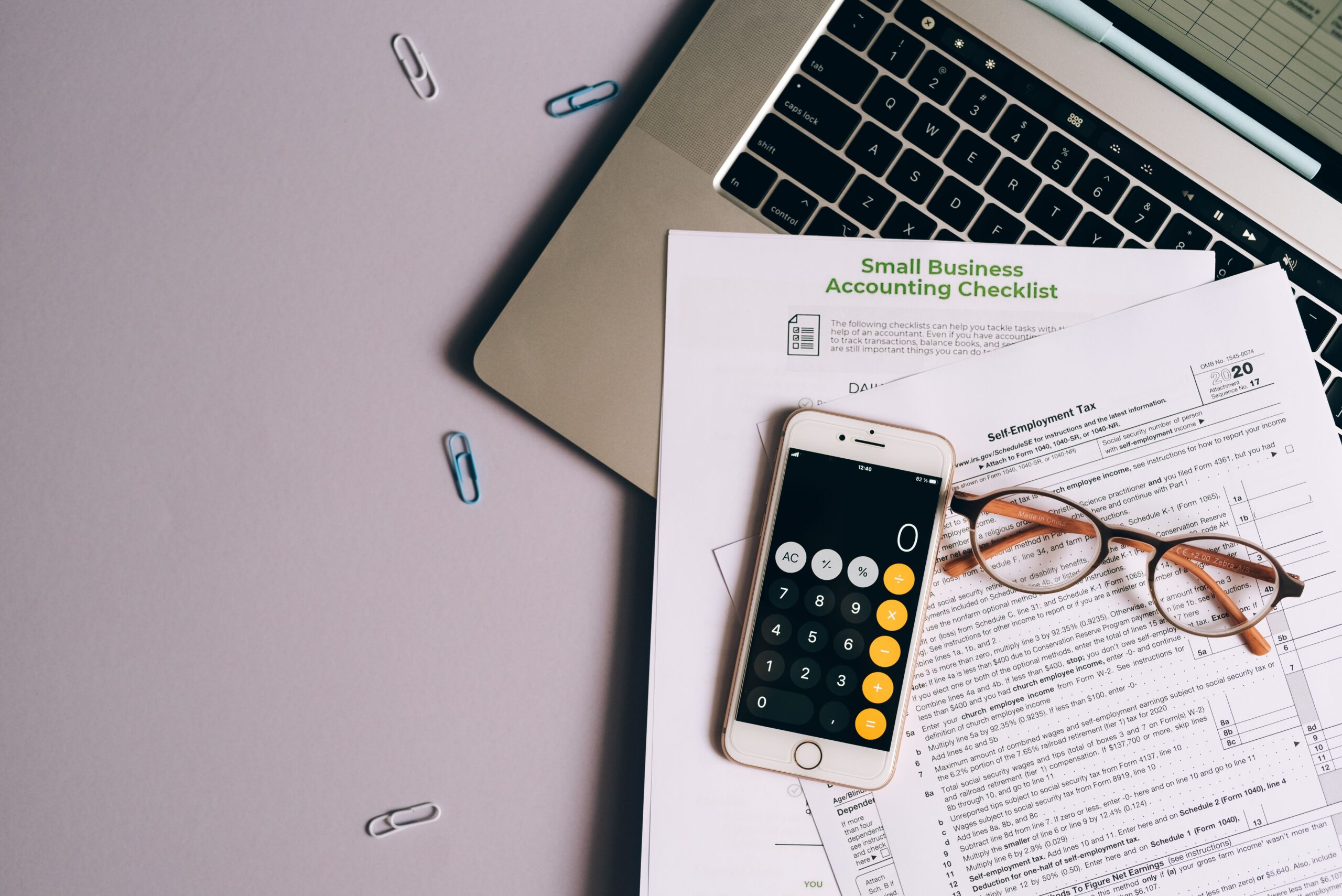 Calculator and documents representing tax filing